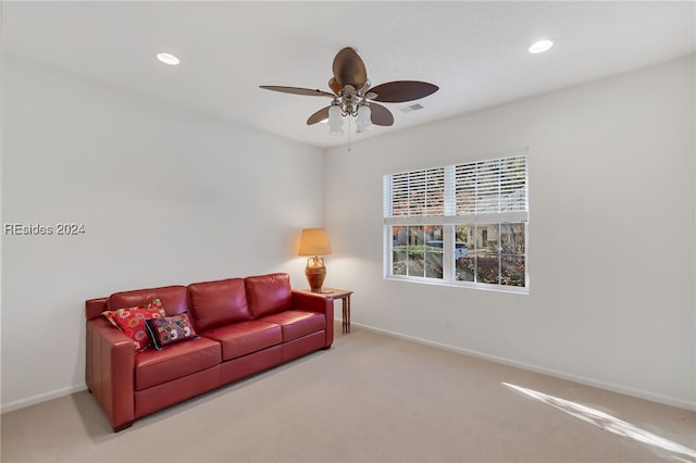 living room featuring ceiling fan and carpet flooring