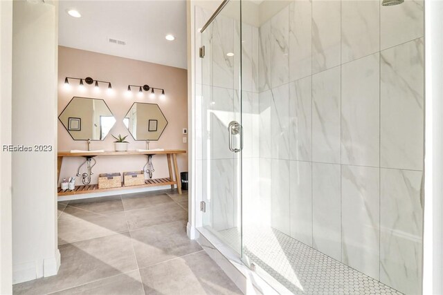 bathroom with vanity, tile patterned floors, and a shower with shower door