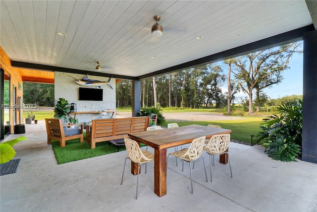 view of patio / terrace with an outdoor living space and ceiling fan