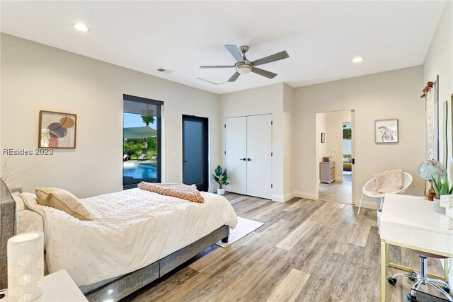 bedroom with light wood-type flooring, access to outside, ceiling fan, and a closet