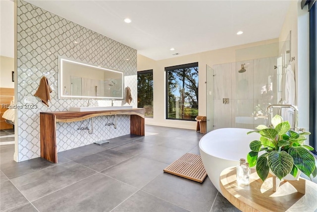 bathroom featuring separate shower and tub