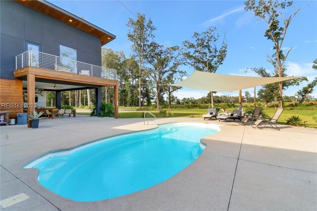 view of swimming pool featuring a patio area