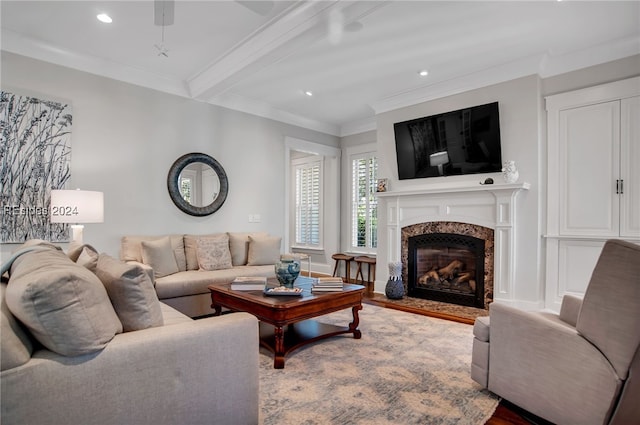 living room featuring beam ceiling, crown molding, hardwood / wood-style floors, and a high end fireplace