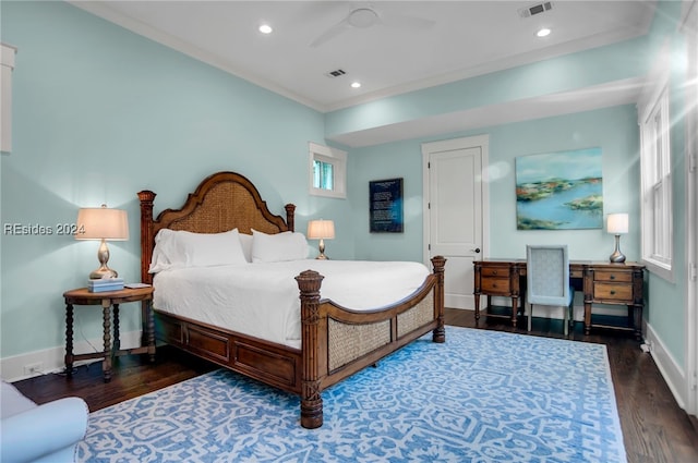 bedroom featuring dark hardwood / wood-style flooring, crown molding, and ceiling fan