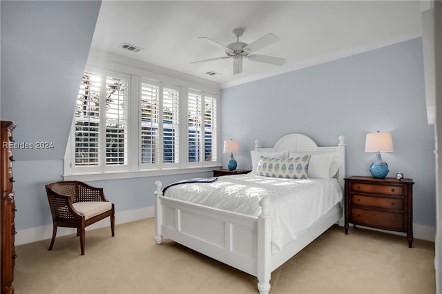 carpeted bedroom featuring crown molding and ceiling fan