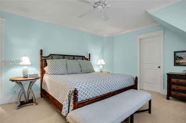 bedroom with ceiling fan, ornamental molding, and light carpet