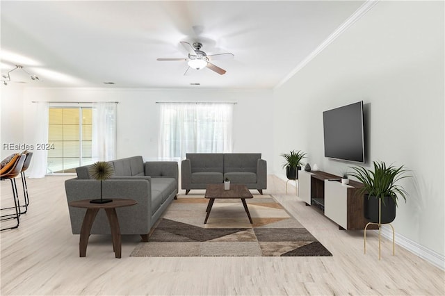 living room with ceiling fan, crown molding, and a healthy amount of sunlight