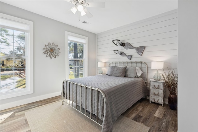 bedroom with hardwood / wood-style floors and ceiling fan