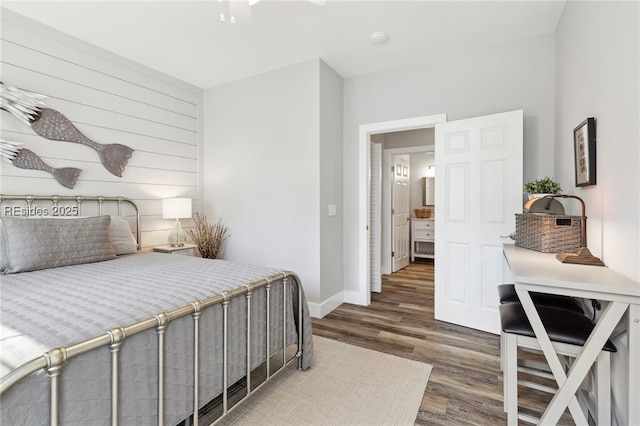 bedroom with ceiling fan and dark hardwood / wood-style flooring