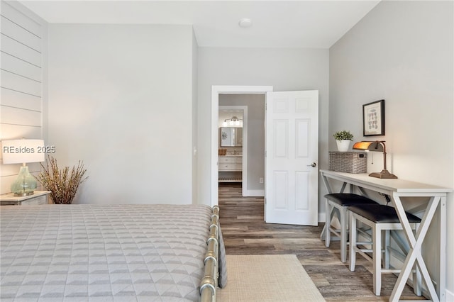 bedroom with dark wood-type flooring