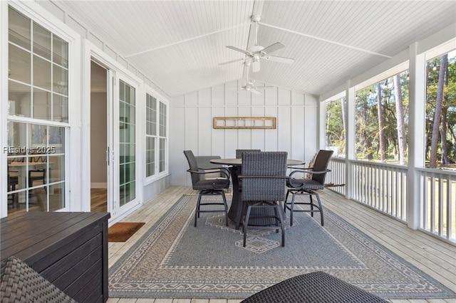 sunroom / solarium featuring ceiling fan and lofted ceiling