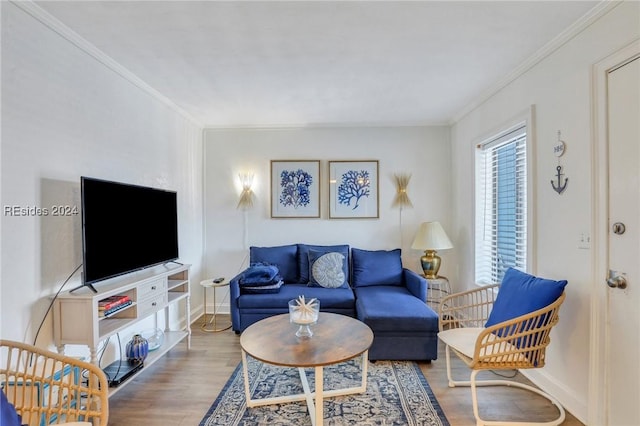 living room with hardwood / wood-style floors and crown molding