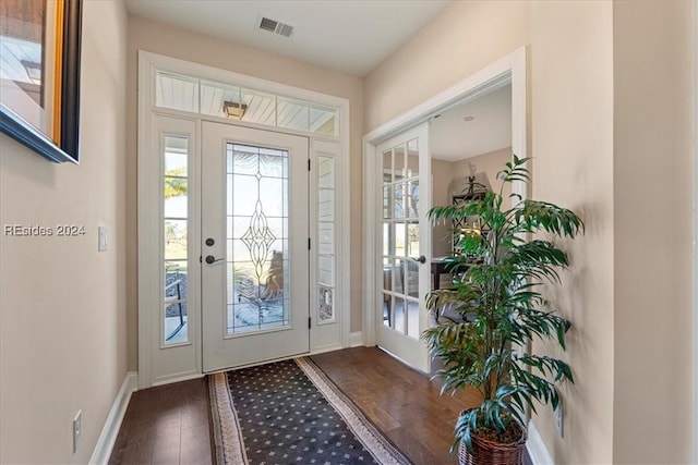 doorway with dark hardwood / wood-style flooring