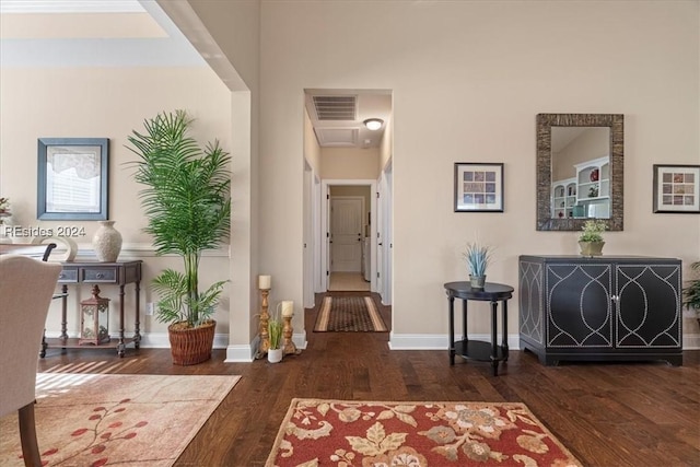 hallway with dark hardwood / wood-style floors