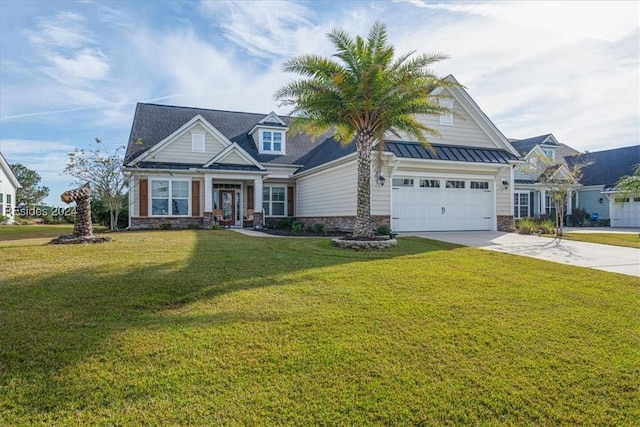 craftsman-style house featuring a garage and a front yard