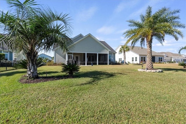 view of yard with a sunroom