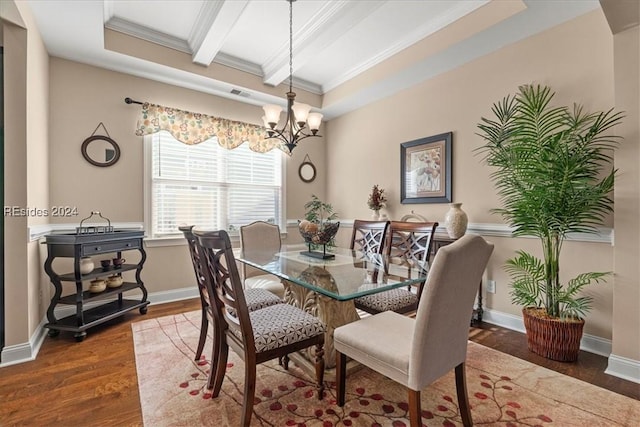 dining room with beamed ceiling, ornamental molding, a notable chandelier, and dark hardwood / wood-style flooring