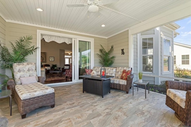 view of patio / terrace with an outdoor living space and ceiling fan