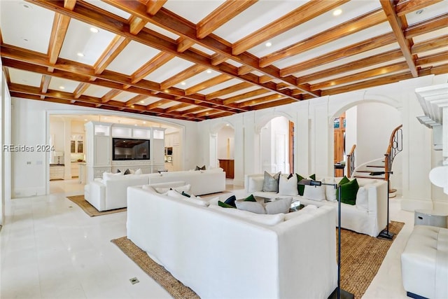 living room with beamed ceiling and coffered ceiling