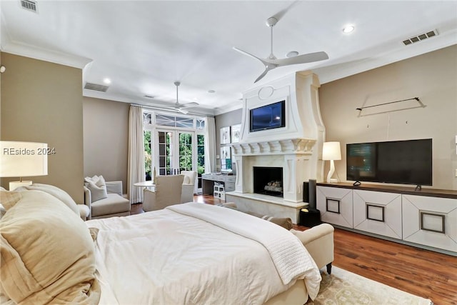 bedroom with hardwood / wood-style flooring, ceiling fan, ornamental molding, and french doors