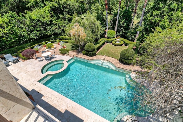 view of swimming pool with a patio area and an in ground hot tub