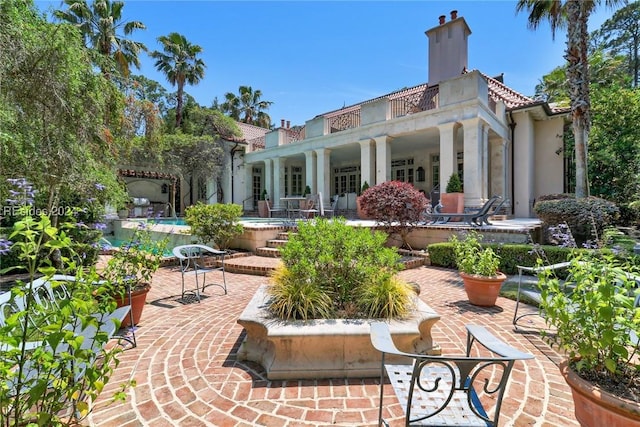 rear view of house featuring a patio