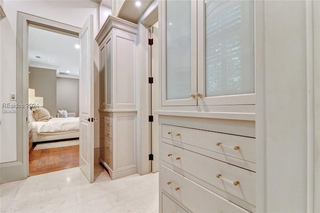 walk in closet with light tile patterned floors