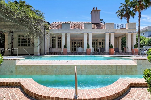 view of pool featuring a patio