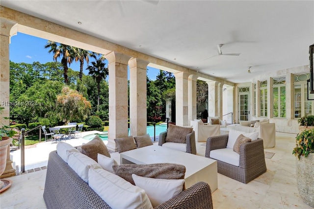 view of patio featuring outdoor lounge area and ceiling fan