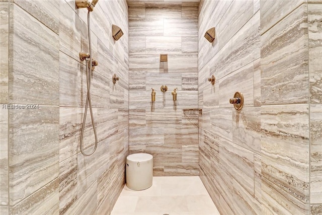 bathroom with a tile shower