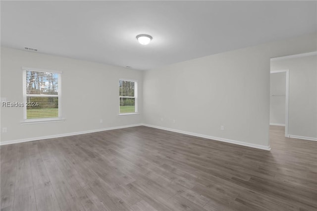 spare room with hardwood / wood-style flooring