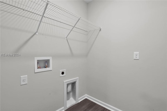 washroom with hookup for an electric dryer, hookup for a washing machine, and hardwood / wood-style floors