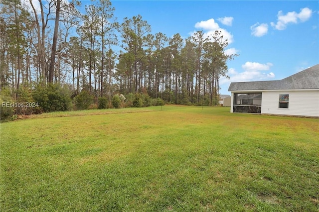 view of yard featuring a sunroom