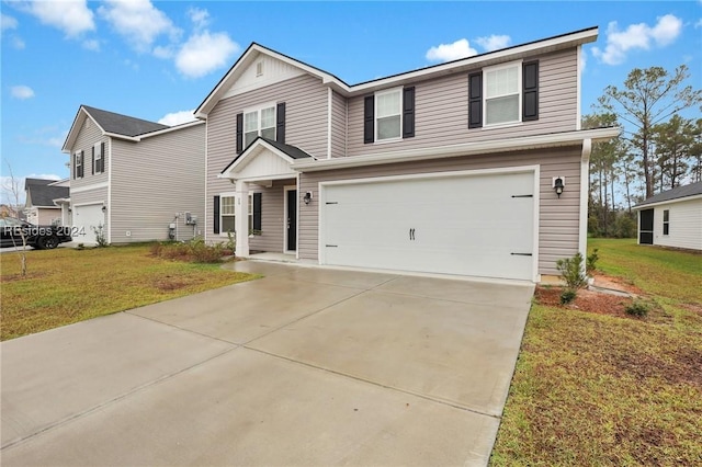 view of front of home with a garage and a front lawn