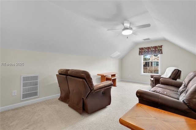 carpeted living room featuring ceiling fan and vaulted ceiling