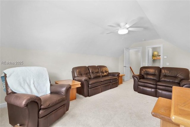 living room with lofted ceiling, light carpet, and ceiling fan