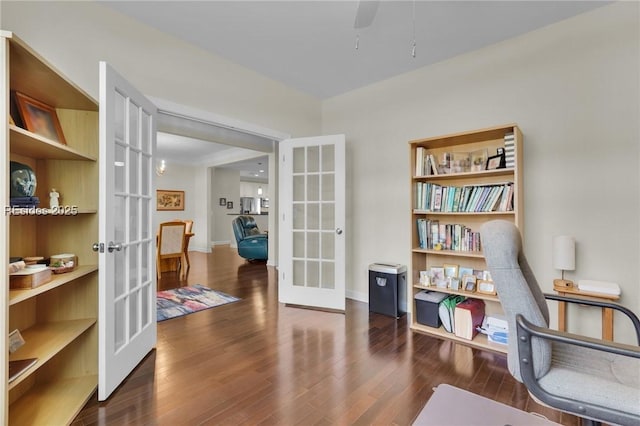 sitting room featuring dark hardwood / wood-style flooring and french doors