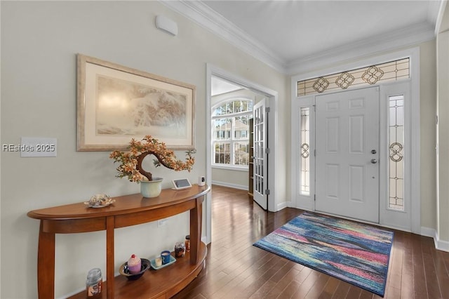 foyer featuring dark wood-type flooring and ornamental molding