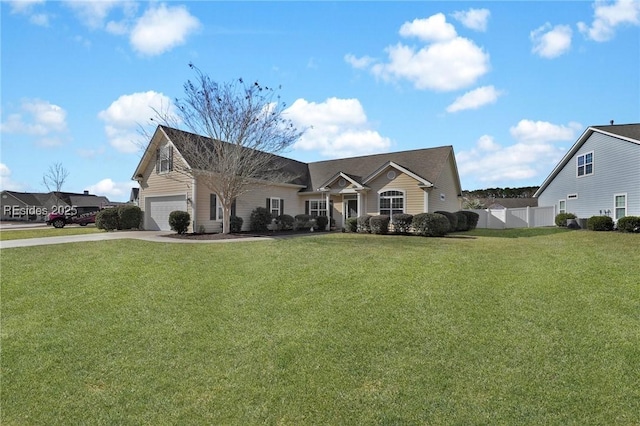 view of front of house featuring a garage and a front yard