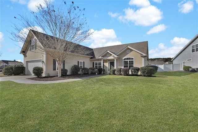 view of front of home with a garage and a front yard