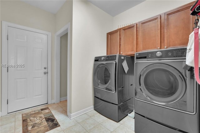 laundry area with cabinets and separate washer and dryer