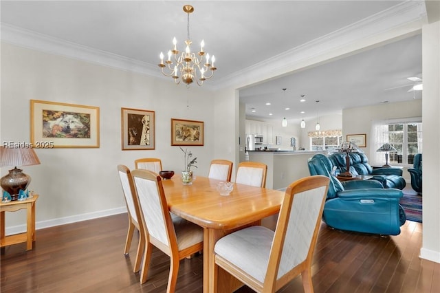 dining space featuring ceiling fan with notable chandelier, ornamental molding, and dark hardwood / wood-style floors