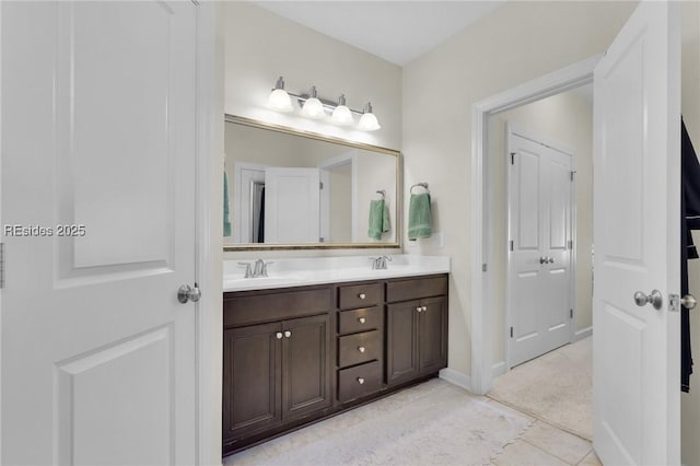 bathroom featuring tile patterned flooring and vanity