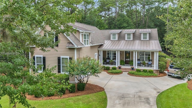 view of front of house featuring a front yard and covered porch