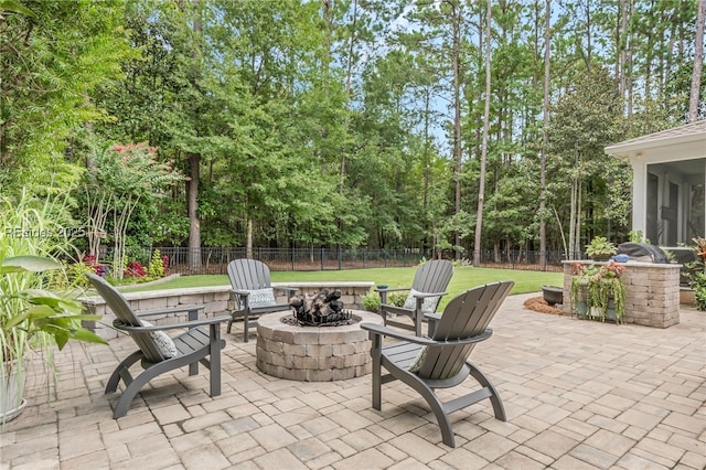 view of patio / terrace featuring an outdoor fire pit