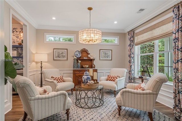 living area with ornamental molding and wood-type flooring