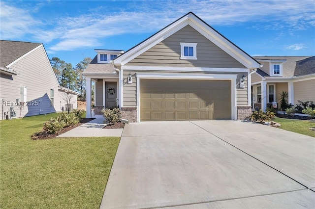 view of front of home with a garage and a front yard