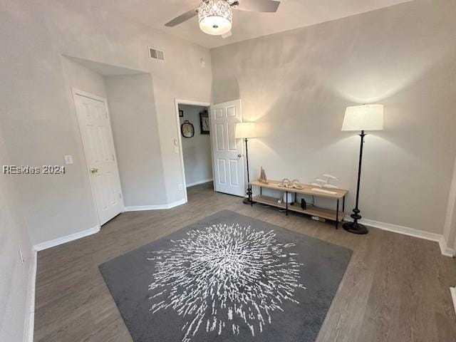 interior space featuring ceiling fan and dark hardwood / wood-style flooring