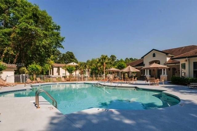 view of pool featuring a patio