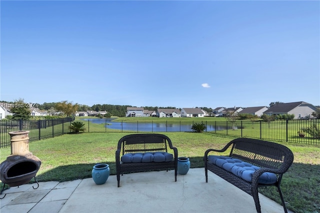 view of patio with a water view